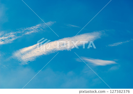 Wave clouds flowing in the blue sky d-3 Warm colors added 127382376