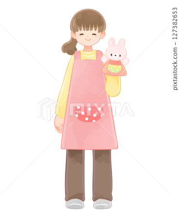 A nursery school teacher holding a rabbit puppet, long sleeves 127382653