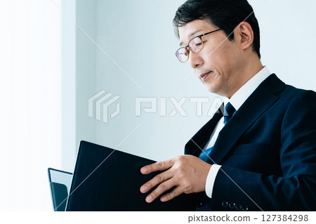 Businessmen checking materials 127384298