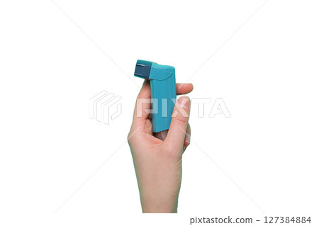 Teal inhaler gripped for asthma, isolated on white background Teal inhaler gripped for asthma, isolated on white background 127384884