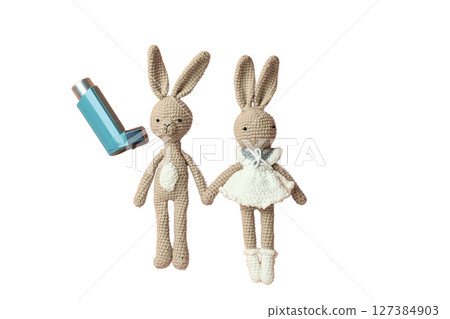 Health-themed crochet rabbits and inhalers, isolated on white 127384903