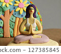 Clay Figurine of Woman in Yoga Pose 127385845