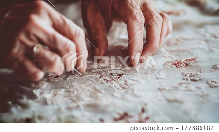 Hands work intricate craft, delicate textile. Craft creates beauty, mindful craft Hands work intricate craft, delicate textile. Craft creates beauty, mindful craft 127386182