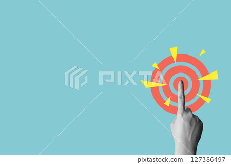 Human hand touching a dartboard on a colored background. Concept of taking action. Collage art 127386497
