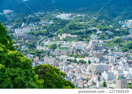 [Shizuoka Prefecture] Atami cityscape with various buildings lined up along the coast 127388839