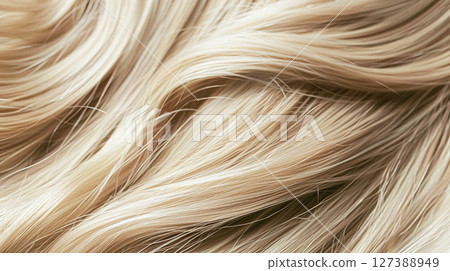 Perfectly styled blonde hair with shimmering waves and rich highlights, showcasing healthy, vibrant texture suitable for beauty and haircare visuals. Perfectly styled blonde hair with shimmering waves and rich highlights, showcasing healthy, vibrant texture suitable for beauty and haircare visuals. 127388949