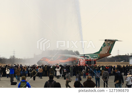 A C-1 transport plane passes through a water cannon at a retirement ceremony. A C-1 transport plane passes through a water cannon at a retirement ceremony. 127390870