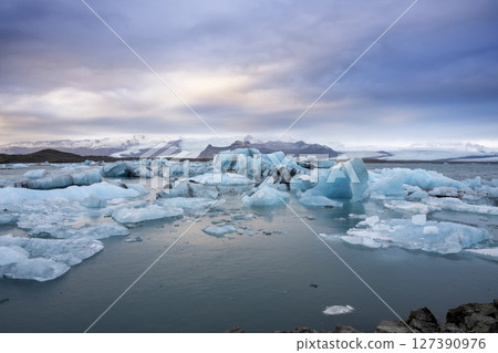 View of the melting glacier on Jokulsarlon Glacier Lagoon, Iceland 127390976