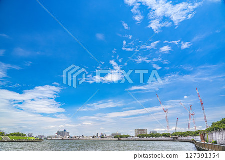 Scenery of the Okutonakagawa River and a crane under the blue sky in June Scenery of the Okutonakagawa River and a crane under the blue sky in June 127391354