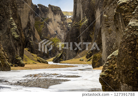 Panoramic view of Fjadrargljufur Canyon with Fjadrar river flow on Iceland. Nature, travel, winter background, or wallpaper 127391788