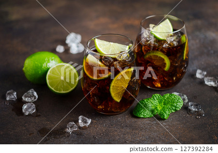 Cuba Libre with brown rum, cola and lime. Cuba Libre or long island cocktail. 127392284