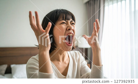 Woman screaming at home (AI-generated image) 127392935