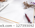 Pen, notebook and dried flowers 127393092