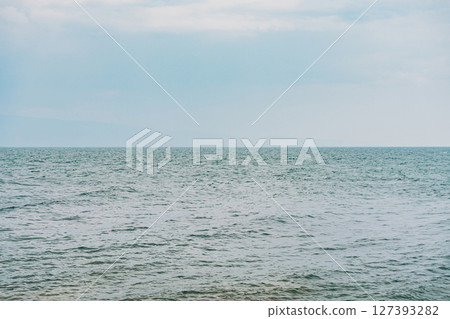 Sea, sky and horizon. Water with ripple, soft color backdrop 127393282