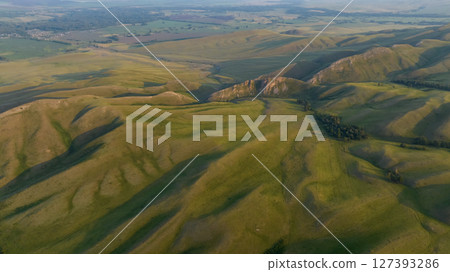 Fields in the mountains. Aerial view. Fields in the mountains. Aerial view. 127393286