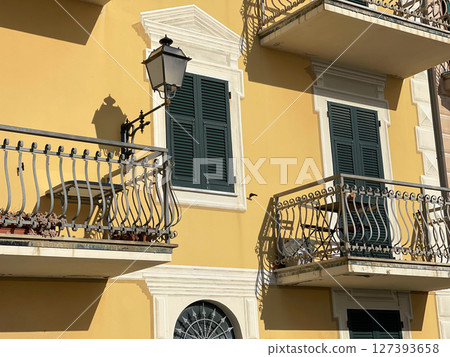 Old street in Italian countryside near sea. Traditional building. Sun day. Entrance, window to house.  127393658