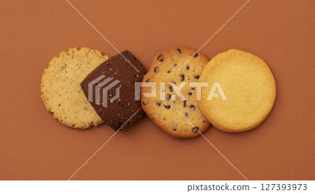 Cookies lined up. On a brown background Cookies lined up. On a brown background 127393973