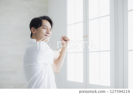 A man stretching A man stretching 127394219