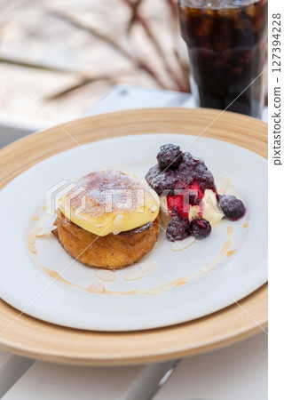 Pancakes and ice cream with berries 127394228