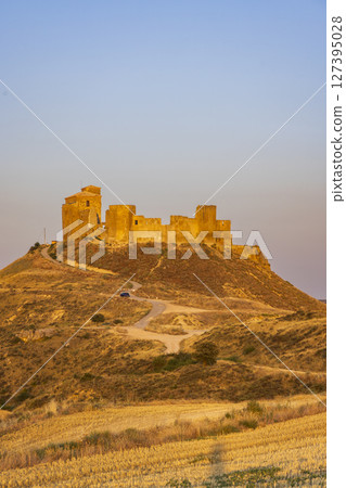Castillo de Montearagon standing tall on a hill in Quicena, Spain, during golden hour 127395028