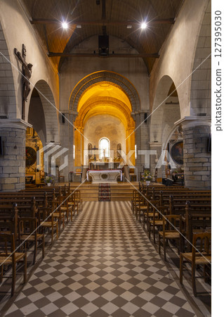 Interior of Saint Philbert Church showing altar, crucifix and wooden chairs in Noirmoutier en l'Ile, France Interior of Saint Philbert Church showing altar, crucifix and wooden chairs in Noirmoutier en l'Ile, France 127395030