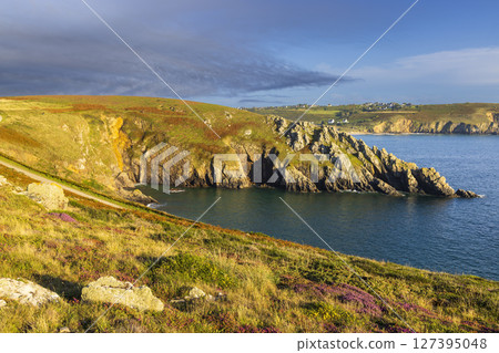 Pointe de Kastel Koz in Cleden Cap Sizun, Brittany, France, overlooking the Atlantic Ocean during a colorful sunset Pointe de Kastel Koz in Cleden Cap Sizun, Brittany, France, overlooking the Atlantic Ocean during a colorful sunset 127395048