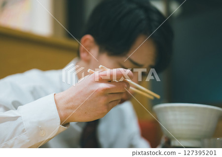Office worker dining out at night Office worker dining out at night 127395201