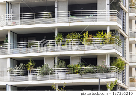 Balconies with plants decorating a modern building in Montpellier, France 127395210