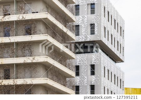 Modern architecture featuring decorative facade and climbing plants in Montpellier, France 127395211