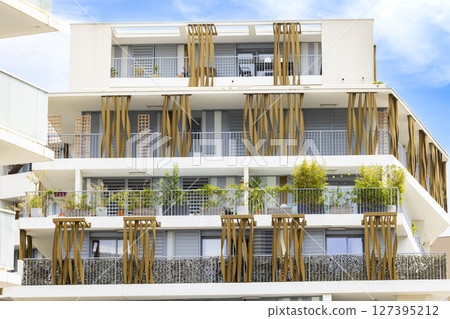 Modern apartment building with balconies and plants in Montpellier, France 127395212