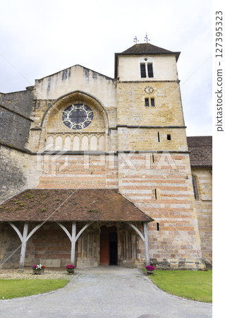 Saint Pierre Abbey Church showing its entrance and bell tower in Sorde l'Abbaye, France 127395323