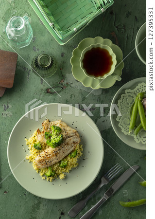 Delicious grilled fish fillet with broccoli and couscous enjoying a healthy meal 127395331