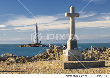 Phare de la Hague lighthouse standing on rocky islet in Normandy, France 127395351