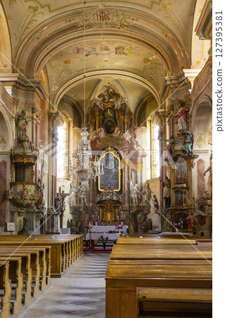 Ornate baroque interior of the Church of Saint Peter and Paul in Ustek, Czechia, illuminating faith and history Ornate baroque interior of the Church of Saint Peter and Paul in Ustek, Czechia, illuminating faith and history 127395381