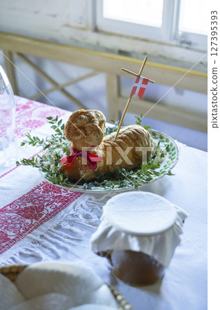 Easter lamb cake with danish flag on white tablecloth in Kourim 127395393