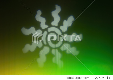 White sun shining over green and yellow background White sun shining over green and yellow background 127395413