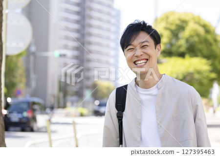 A man in his 40s smiling at the camera 127395463