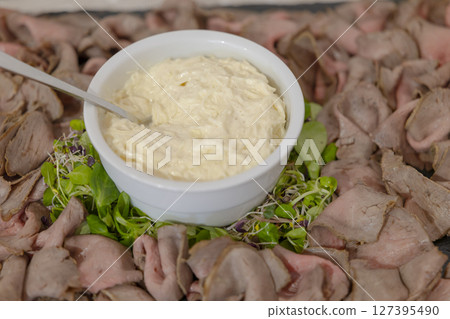 Remoulade sauce served with roast beef slices and salad sprouts Remoulade sauce served with roast beef slices and salad sprouts 127395490