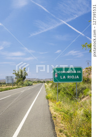 Road entering La Rioja Community in Spain during summer sunny day 127395531