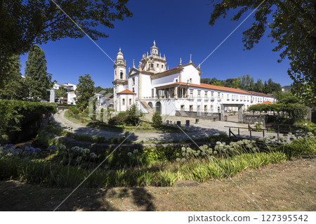 Mosteiro de Sao Miguel de Refojos illuminating Parque do Mosteiro in Cabeceiras de Basto, Portugal 127395542