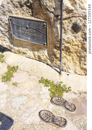 Sahagun, center of the Camino de Santiago, showing symbolic pilgrim footprints and scallop shell Sahagun, center of the Camino de Santiago, showing symbolic pilgrim footprints and scallop shell 127395549
