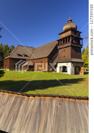 The Articulated Church of Svaty Kriz in Slovakia with Shingle Roof and Bell Tower 127395580