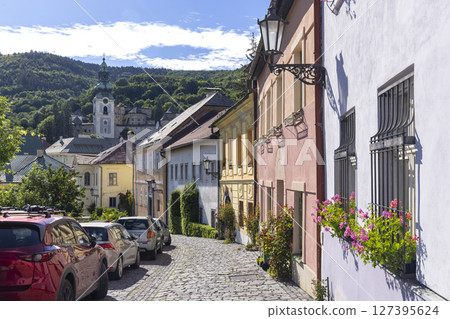 Exploring the charming streets of Banska Stiavnica, Slovakia, with the Old Castle in the background Exploring the charming streets of Banska Stiavnica, Slovakia, with the Old Castle in the background 127395624