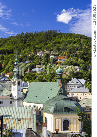 Banska Stiavnica cityscape featuring church towers and green roofs in Slovakia Banska Stiavnica cityscape featuring church towers and green roofs in Slovakia 127395629