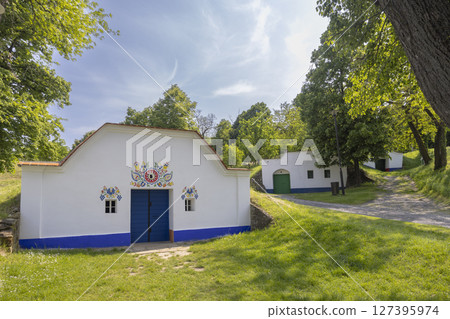 Wine cellars with colorful folk decoration in Petrov Plze, Czech Republic 127395974