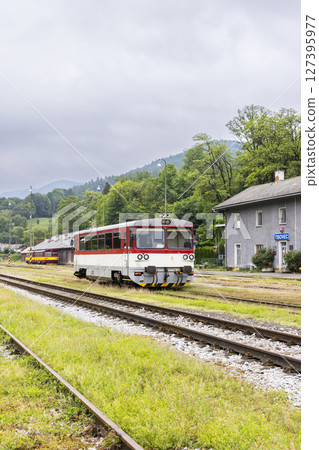 Diesel railcar standing at Tisovec train station in Slovakia 127395977