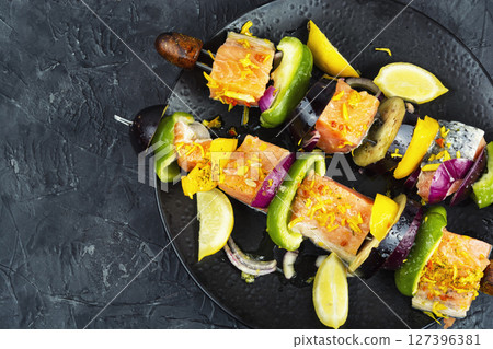 Fresh fish meat on skewers. 127396381