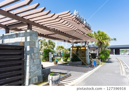 The store, building and signboard of "Amakusa Pearl Garden & Underwater Aquarium Sea Donuts" stand out against the blue sky. The store, building and signboard of "Amakusa Pearl Garden & Underwater Aquarium Sea Donuts" stand out against the blue sky. 127396916