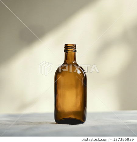 Glass Bottle on Soft Blurred Background with Copy Space 127396959