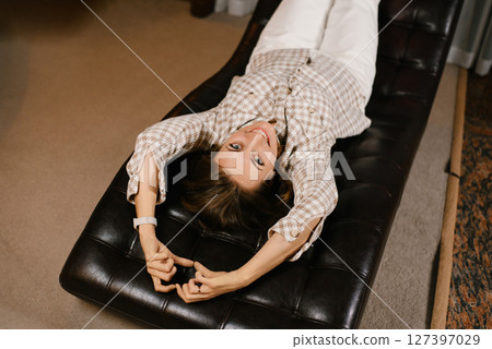 Playful Woman Relaxing In Therapy Chair 127397029